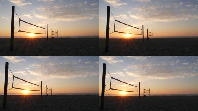 美国加利福尼亚海岸日落海滩运动场上的排球网剪影。