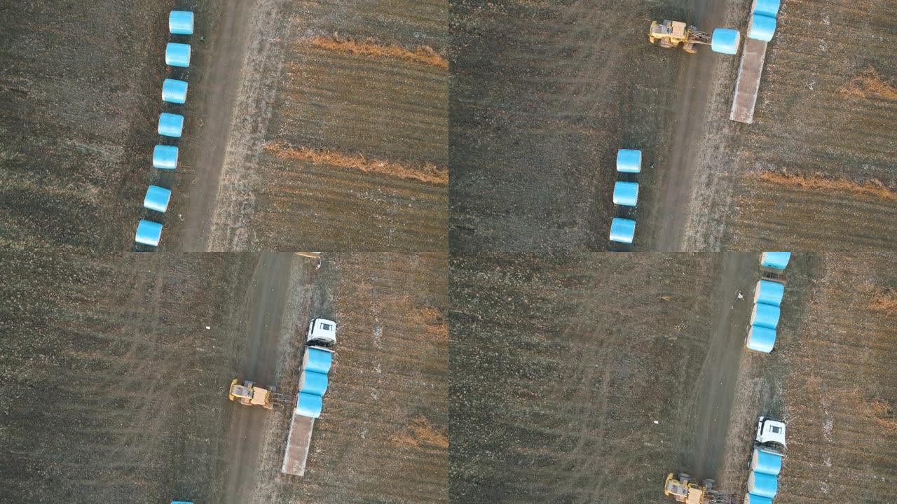 以色列卡车上装载棉包的拖拉机的鸟瞰图。