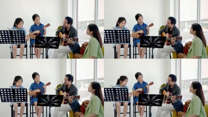 在音乐学校的课堂上，一位音乐老师在教音乐学校的孩子们学习吉他和弦。