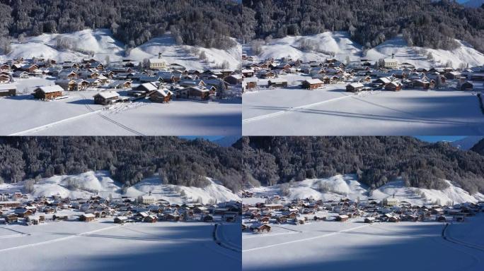 山里一个冰雪覆盖的村庄的鸟瞰图