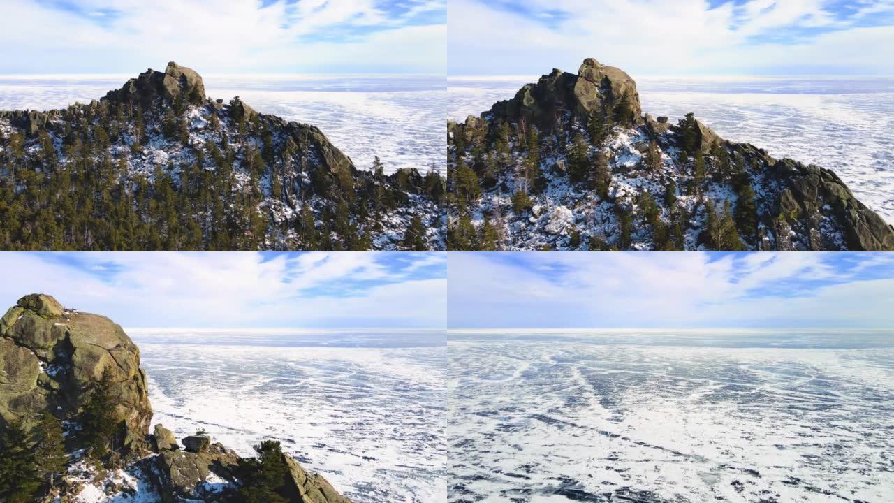 飞越巨大湖岸的白雪覆盖的悬崖。电影景观