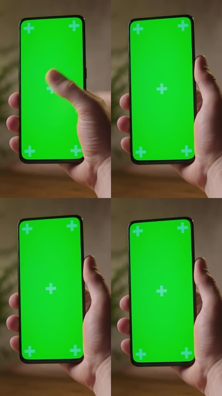 手持摄像头: 手机上的人的后视图，绿屏显示复印空间。带有跟踪标记的Chromakey模型。点击点击屏