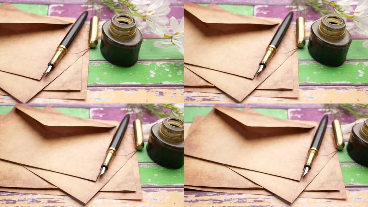 信封、空纸和钢笔放在桌子上