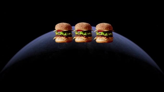 世界汉堡日概念。抽象的行星点亮，汉堡出现。