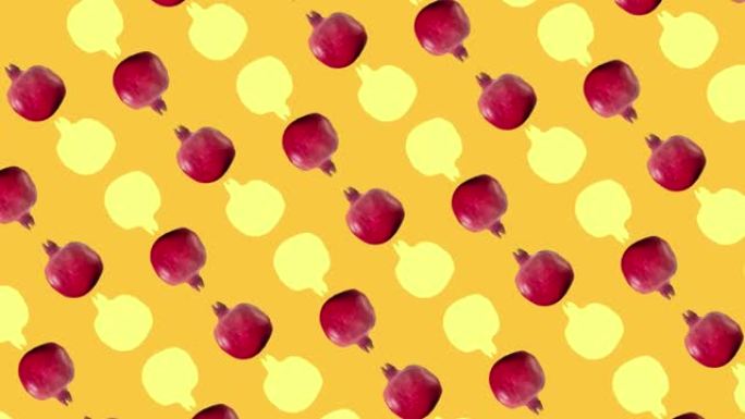 橙色背景上新鲜红色石榴的彩色水果图案。石榴无缝图案。逼真的动画。4k视频运动