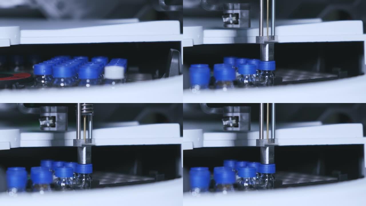 带蓝帽的玻璃小瓶在高效液相色谱自动进样器中旋转