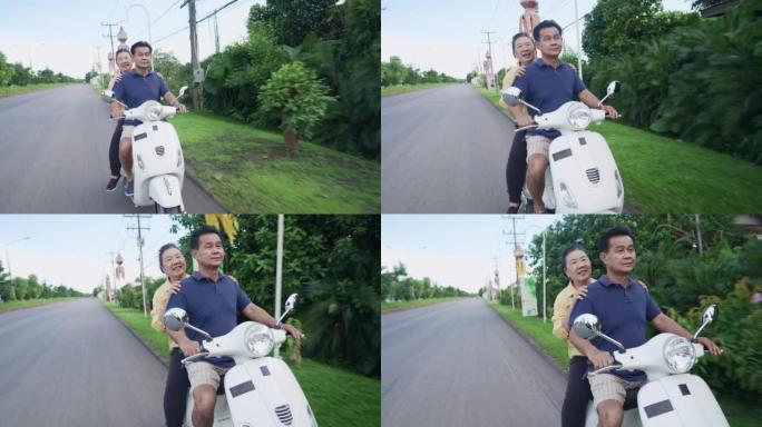 运动激情概念，一对活跃的亚洲老年夫妇喜欢沿着传统的街道骑行，这里有自然独特的道路和亚洲装饰旗帜，老年