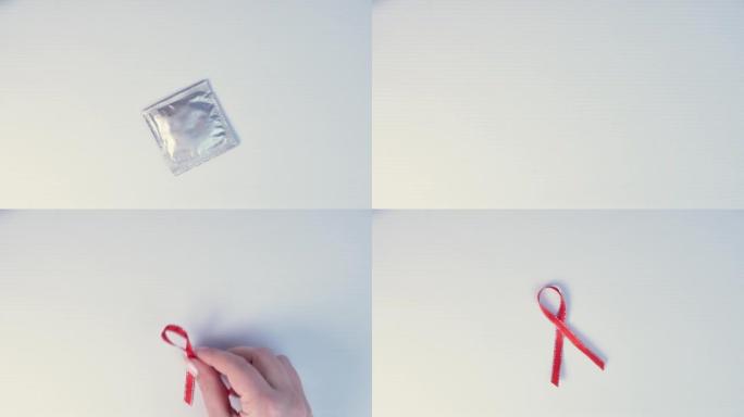 拿套保险套放爱滋病意识红丝带