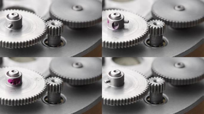 在机械装置中旋转的齿轮。机器金属齿轮旋转抽象