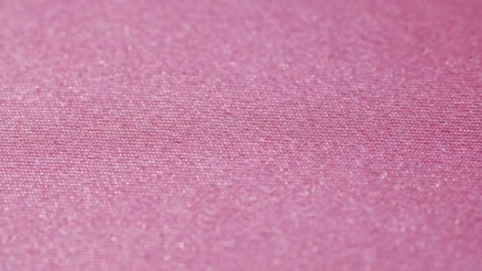 粉色丝绸特写，缎面奢华布料纹理背景。豪华设计纺织品