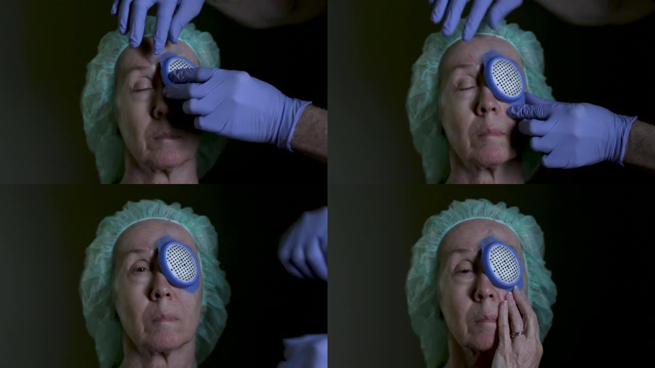 白内障摘除手术后的一名高级妇女在手术的眼睛上放置了保护性眼罩。