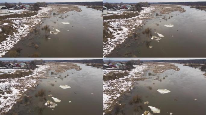 几只又小又脏的白色浮冰漂浮在泥泞的河上。