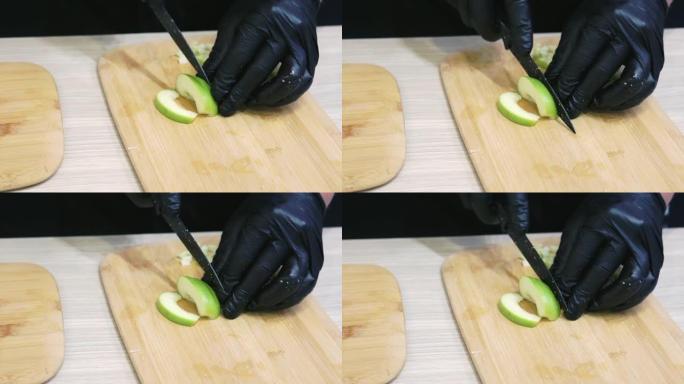厨师用菜刀切苹果