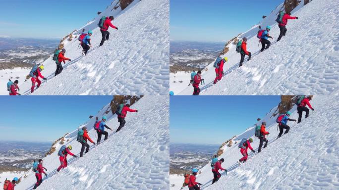 高山登山队冬季在高海拔山峰中连续行走