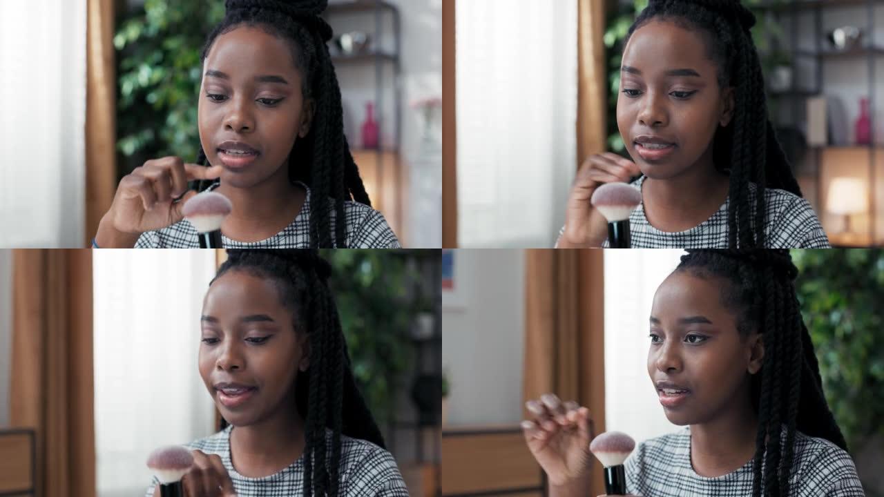 这位化妆师正在与一位给她提供美容建议的朋友交谈，她的脸ofv女人有着非洲裔美国血统的深色皮肤，描述了