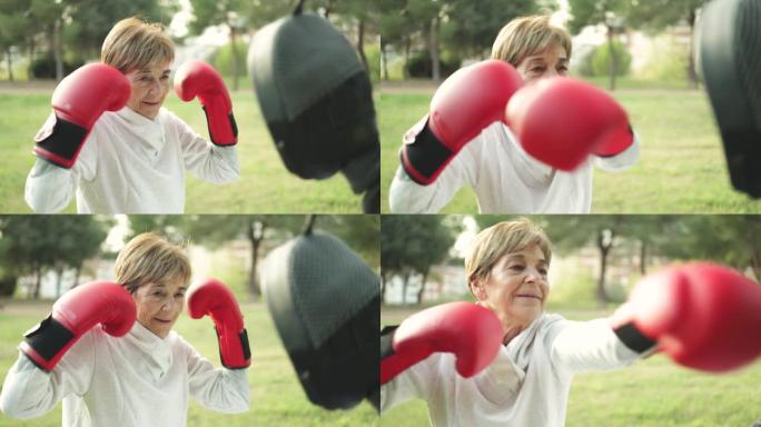 与私人教练一起在户外进行拳击锻炼训练的高级女性