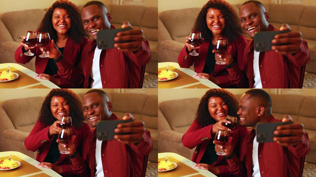 西班牙夫妇约会庆祝周年纪念日，情人节2月14日在智能手机摄像头上进行视频通话或自拍
