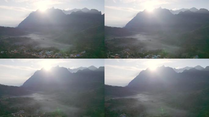 在当地部落村庄的山脉和山谷中，日出的鸟瞰图