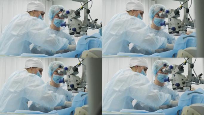 外科团队使用现代技术，最新设备，现代临床中的显微镜制作斜视手术