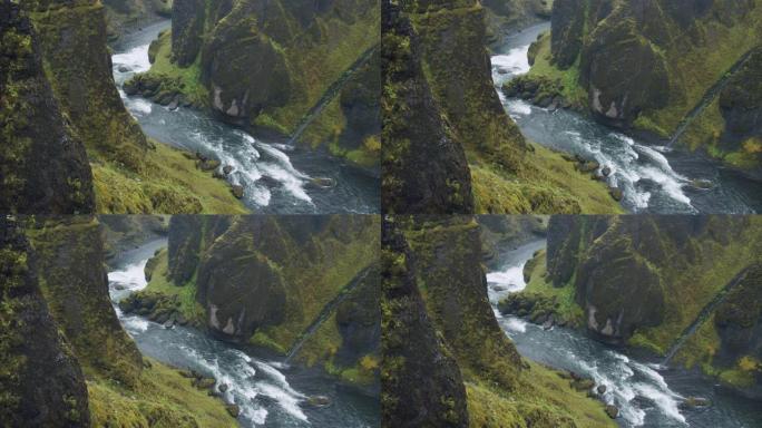 Fjadrargljufur峡谷。蜿蜒的河流在奇异的陡峭悬崖岩层之间。冰岛、欧洲
