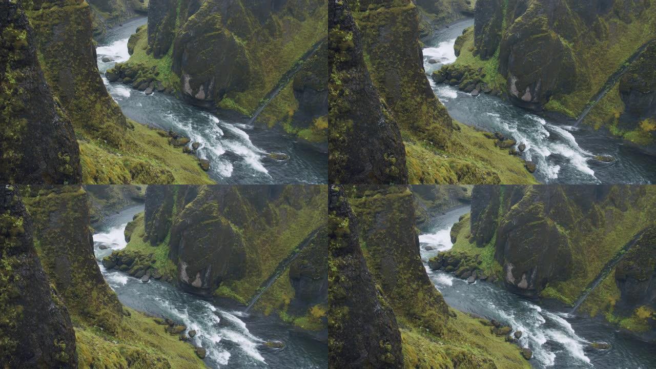 Fjadrargljufur峡谷。蜿蜒的河流在奇异的陡峭悬崖岩层之间。冰岛、欧洲