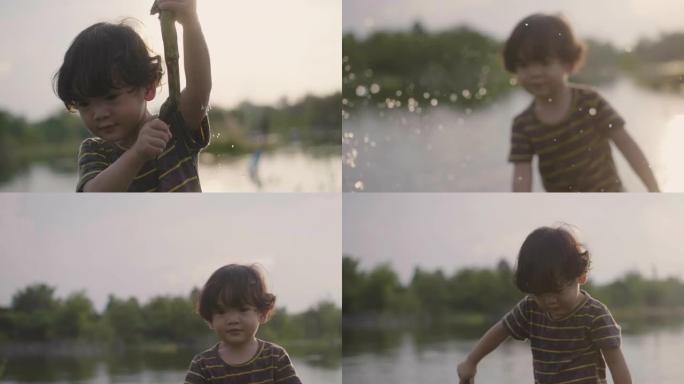 一个男孩在溪流中玩水的景象。