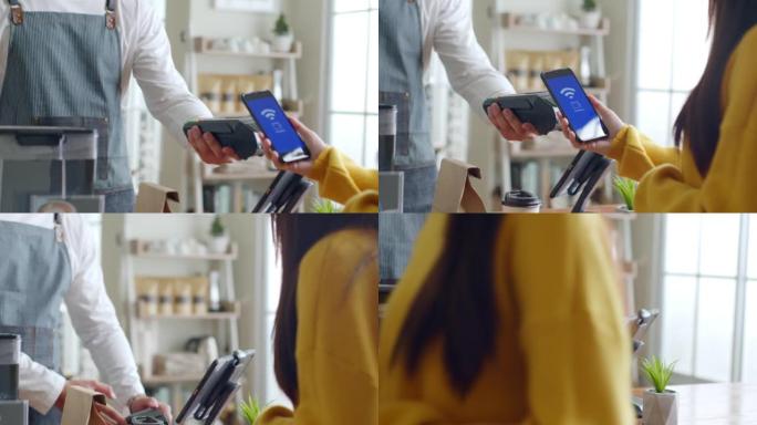客户在咖啡厅餐厅使用智能手机进行NFC支付，无现金，非接触式技术和汇款概念