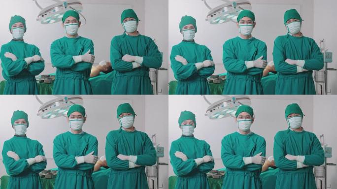 手术室的一组外科医生看着手术室的摄像头