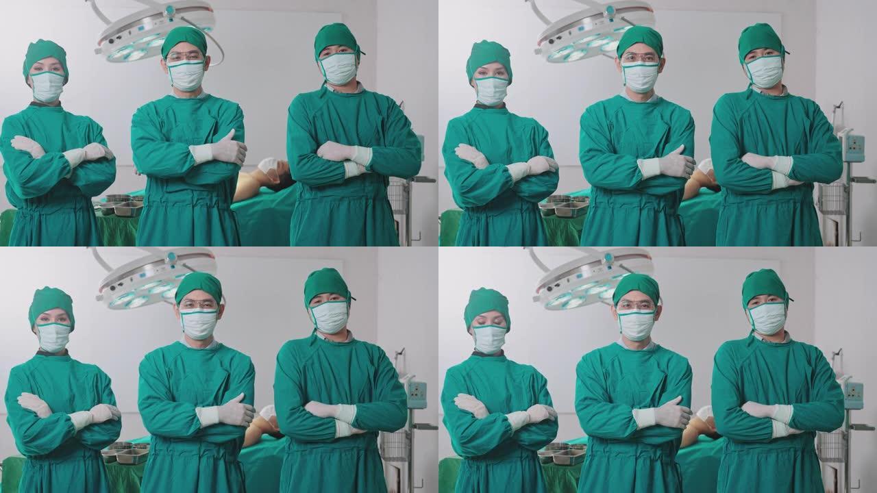 手术室的一组外科医生看着手术室的摄像头