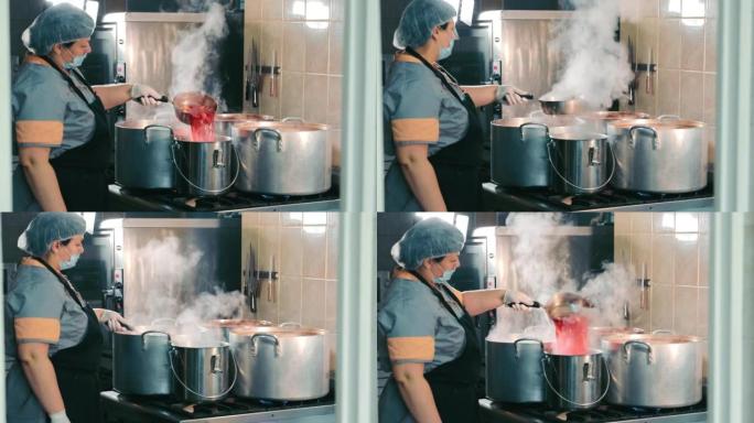 为低收入人群做饭。厨师女人在铝制容器中烹饪。穷人的红色汤