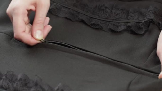 用蕾丝guipure特写手拉黑色衬衫。裁缝服装概念。手工制作的东西，制衣，纺织品样品的宏观拍摄