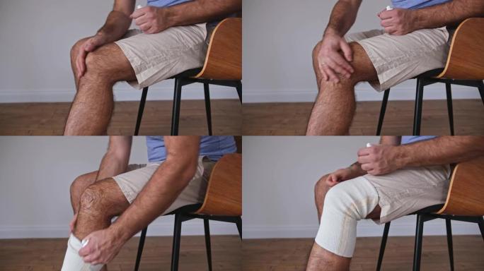 成年白人男性在受伤的膝盖上摩擦止痛药乳膏，并戴上弹性稳定剂带