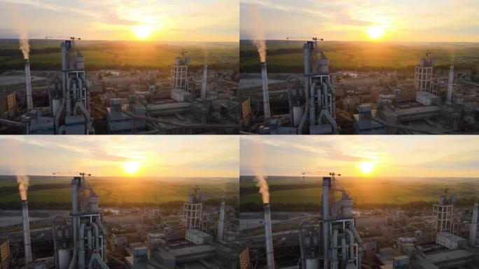 工业生产区高混凝土厂房结构水泥厂和塔式起重机的鸟瞰图。制造与全球工业概念