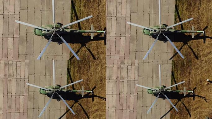 鸟瞰图，军用航空直升机站在机场。军事航空，军事演习。和平时期，直升机停在机场。4 k, ProRes