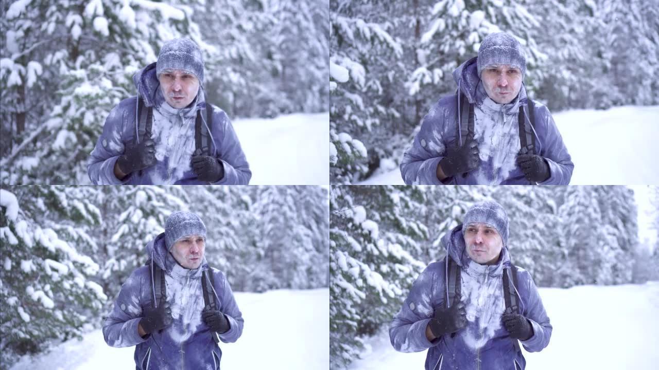 寒冷的冬天里的斯特恩冻人背着背包穿过树林