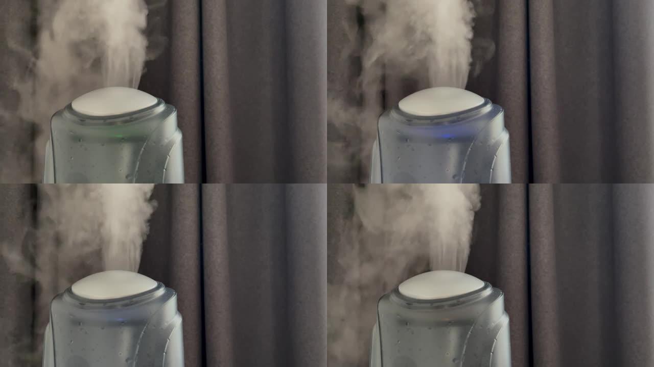 加湿器在灰色窗帘背景上工作。来自加湿器的水雾蒸汽。