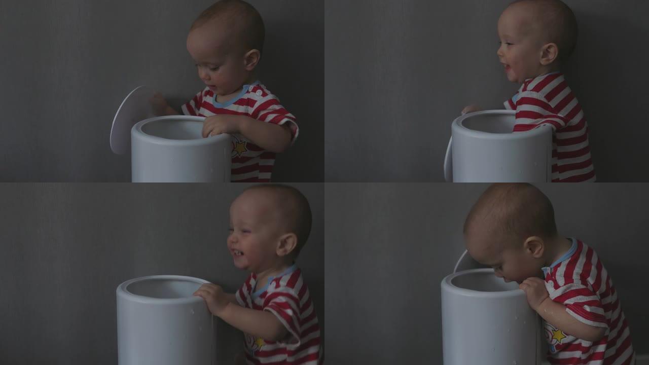 有趣的男婴孩子玩水箱空气加湿器蒸汽雾储液器