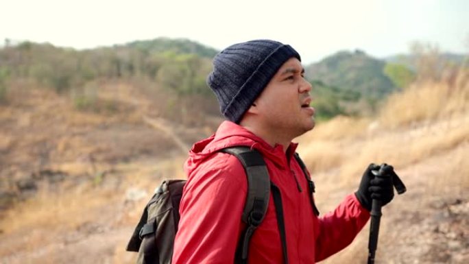 自信而有力量的人，背着背包徒步旅行，在户外度假时在落基山脉散步。男子旅行者在假日自然探险旅行中登山。