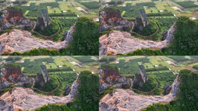 宋卡府奇怪形状山Khao Kuha的空中无人机日出场景。有绿色林木的山。泰国的自然景观背景。黄山。