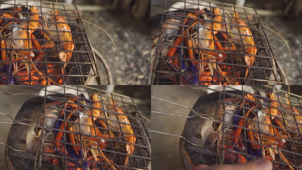 巨型淡水虾在传统火炉上烧烤。潘开枪。假日假期烧烤海鲜菜单。泰国菜。泰国。