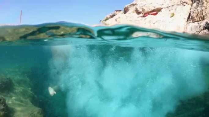 4k视频，男性享受暑假在希腊扎金索斯的海底跳跃和游泳