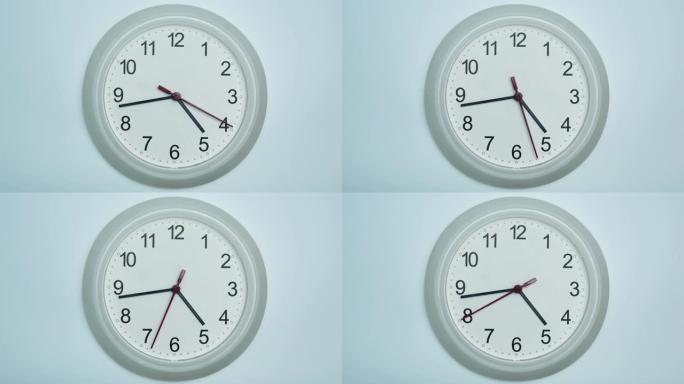 白色挂钟显示5点前20分钟的时间。