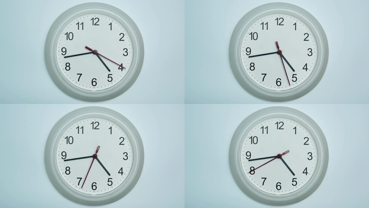 白色挂钟显示5点前20分钟的时间。