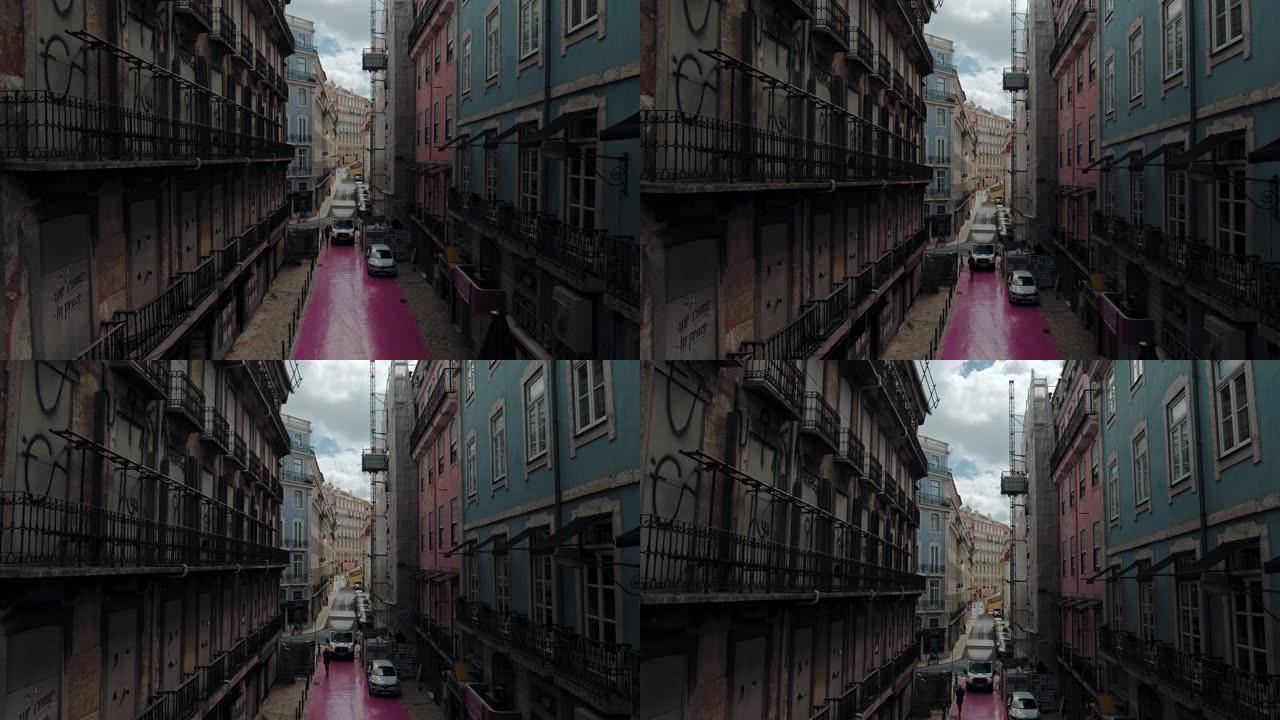 里斯本一条带有彩色房屋的葡萄牙建筑街的电影视图。