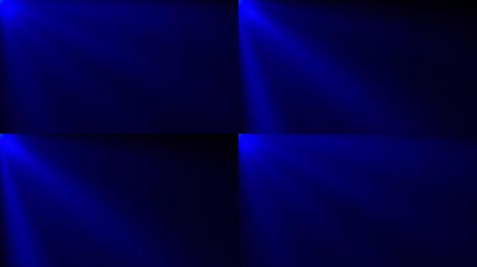 蓝色耀斑光束循环效应抽象背景。4k无缝循环抽象舞台灯光运动从左上角闪亮抽象标题介绍预告片电影效果背景