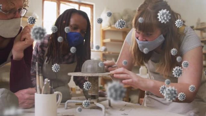 新型冠状病毒肺炎细胞对在陶轮上工作的各种女性陶工的合成视频