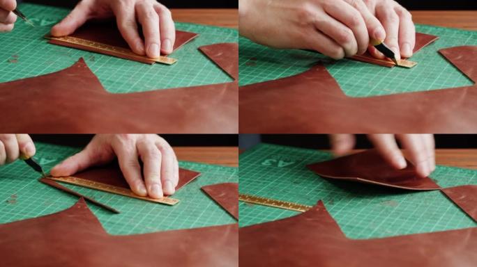 男士裁缝切割人造革与尺子特写。工匠在工作场所的桌子上雕刻牛皮，制作由真皮动物皮革制成的手工产品。专业