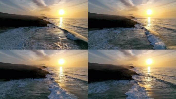 大西洋上空美丽的日落。无人机视频，拍摄了令人惊叹的日落天空。平静的海面和日落橙色的天空。平静的海水上