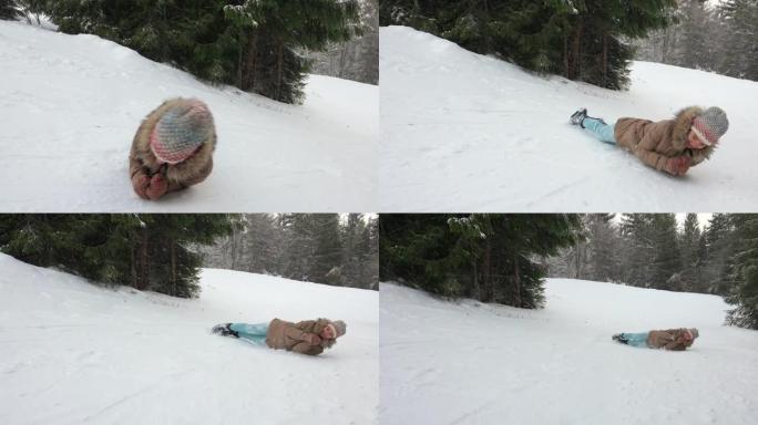 从山上的雪山上滚下来的年轻女孩