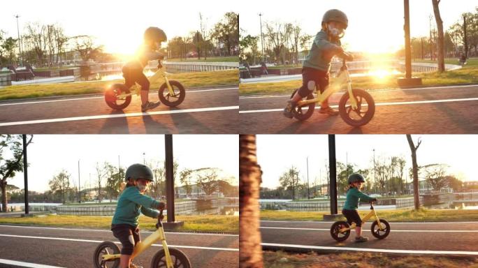 日落时骑平衡自行车的小女孩。